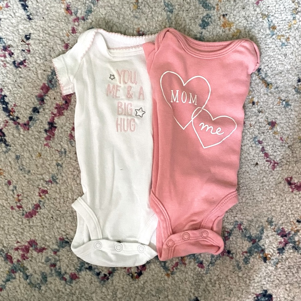 Set of baby girl onesies